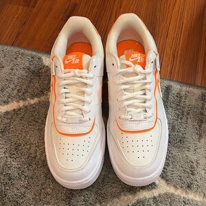 Orange and white Nike Air Force 1